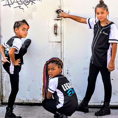 Three Black girls in cool dance poses